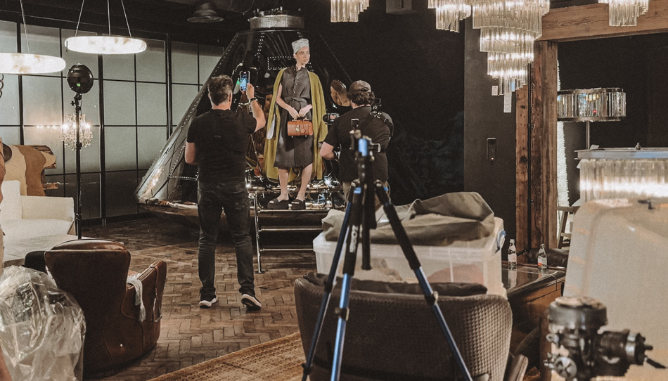 Behind the scenes view of the restricted lighting and camera setup for the Lemuria London fashion campaign